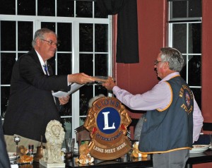 District Governor hands the gavel to newly installed President Grey Baker.