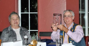 Incoming President Grey Baker with his wife proudly shows his Jack Wiech Fellowship Award.