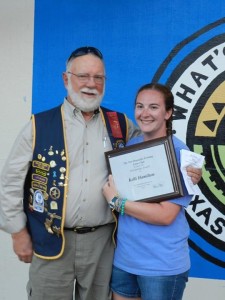 Larry and Kelli with her scholarship award on the ceremonies stage