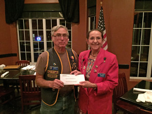 Sandi Schendel, Auxilliary President at Walton F. Hoffmann Memorial Unit 179 of the American Legion, thanks President Grey Baker for our club's sponsorship of 2 girls for the Bluebonnet Girls State.