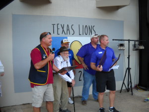 Lion Glenn Herman gives introductory remarks about our 4 scholarships.