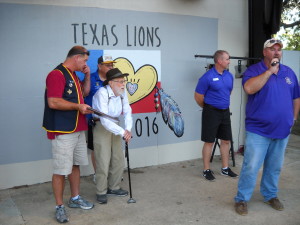 Lion Jeff Kunkel introduces Lion Lin Rose who presented our club scholarship named in his honor.